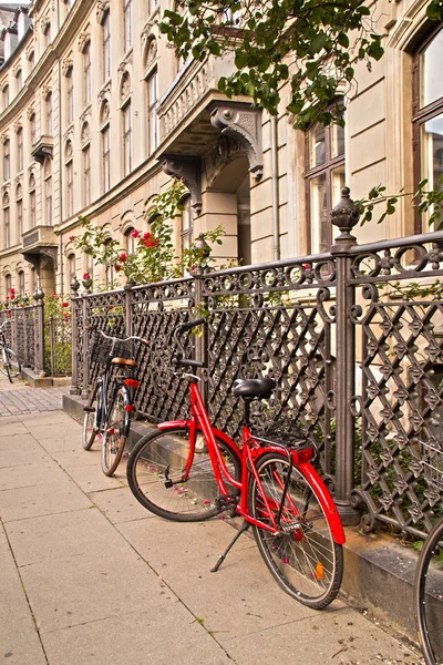Parked Bicycles On Sidewalk in historic part of Copenhagen, Denm