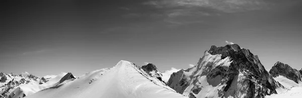 Black and white panorama of snowy mountains