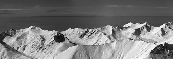 Black and white panoramic view on off-piste slope