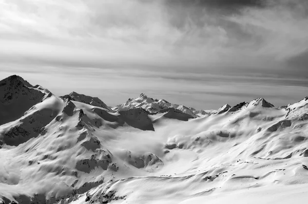 Black and white snowy mountains in evening
