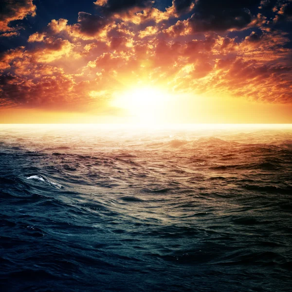 Dramatic sunset over ocean surface