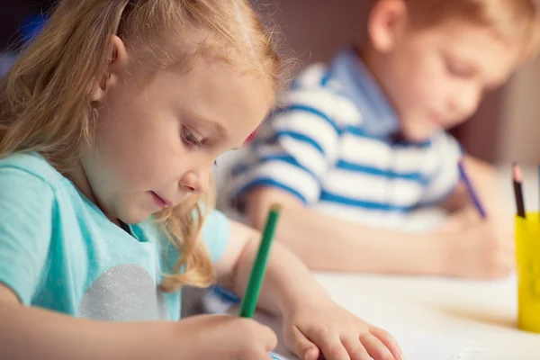 Group of cute little prescool kids drawing