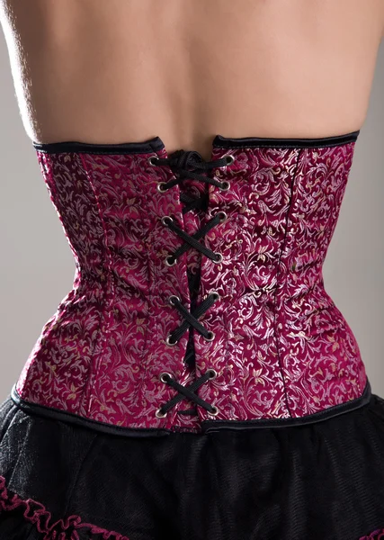 Back view of woman in corset