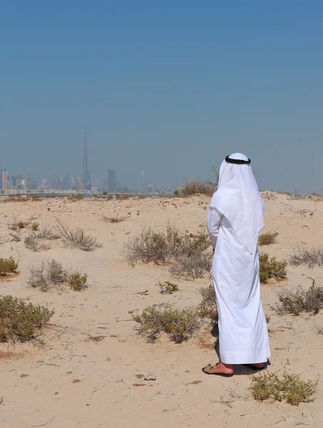 Arab man stands in the desert
