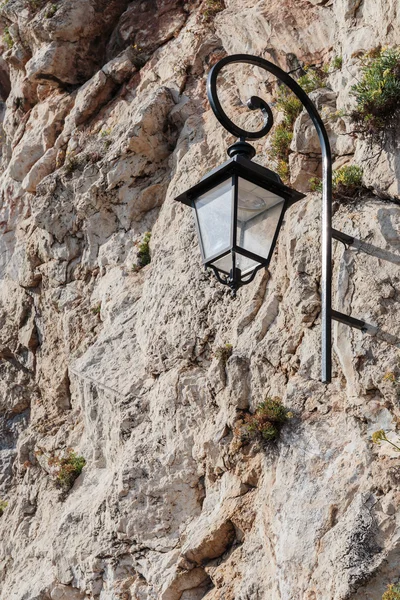 Street lamp on a rock