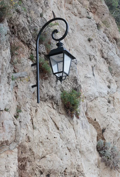 Street lamp on a rock