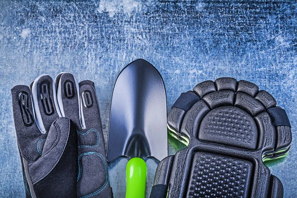 Gardening gloves, knee pads and shovel