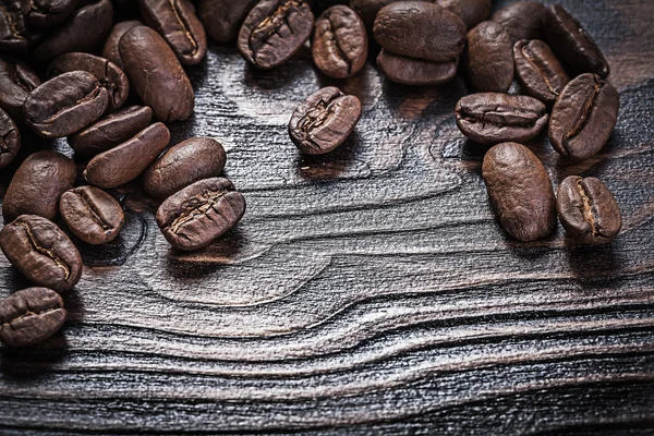 Coffee beans on vintage wood board