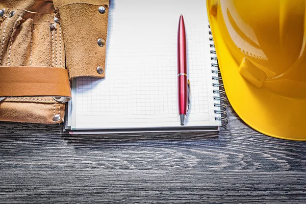 Tool belt, hard hat and notepad
