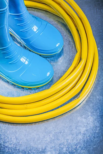 Safety rubber boots and garden hose