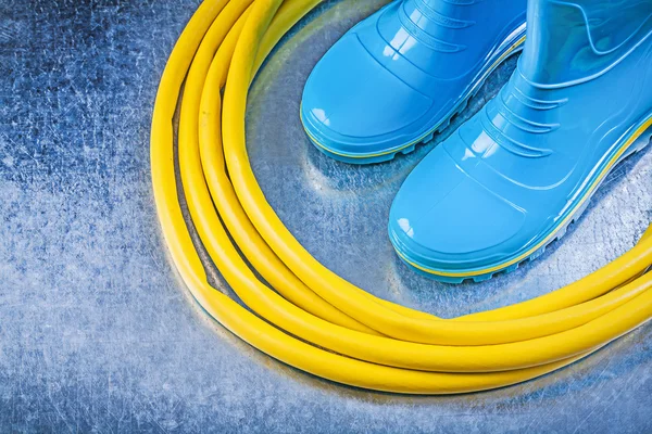 Safety rubber boots and garden hose