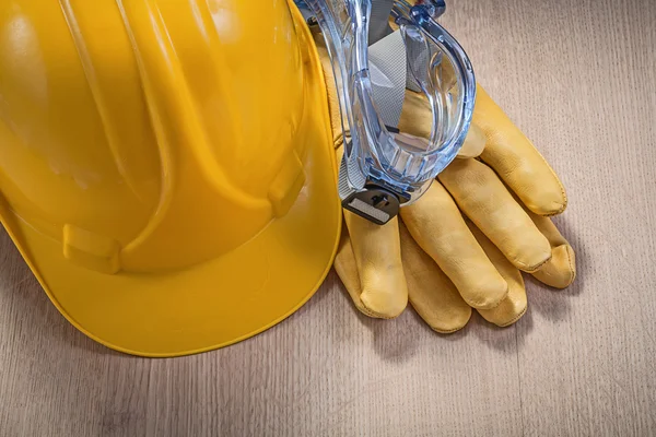 Hard hat, protective gloves and spectacles