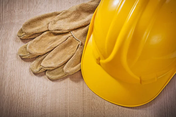 Leather safety gloves and hard hat