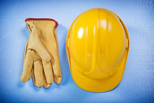Building helmet and leather safety gloves