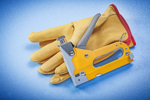 Leather safety gloves and stapler gun