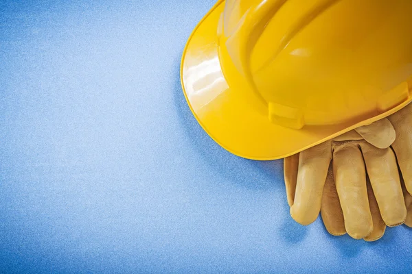 Building helmet and leather safety gloves