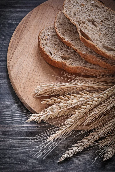 Sliced bread and wheat rye ears