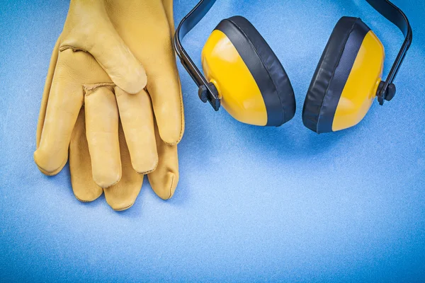Ear protectors and safety gloves