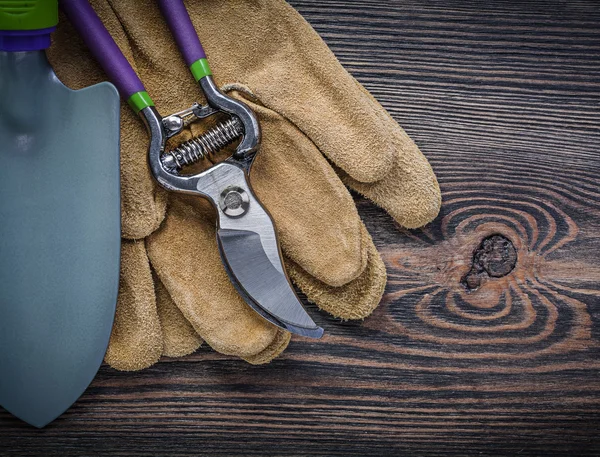 Protective gloves on wooden board