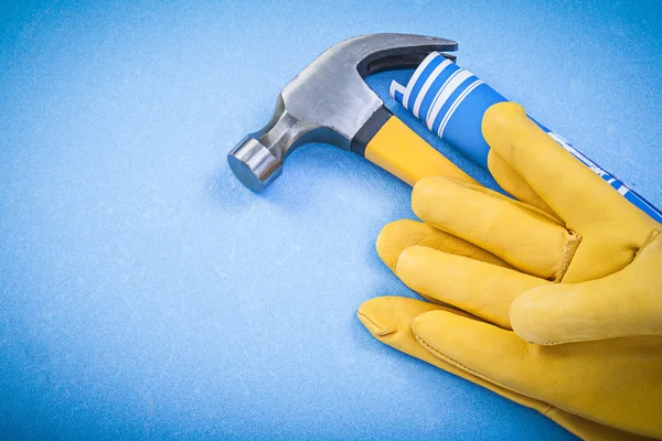 Claw hammer on blue background