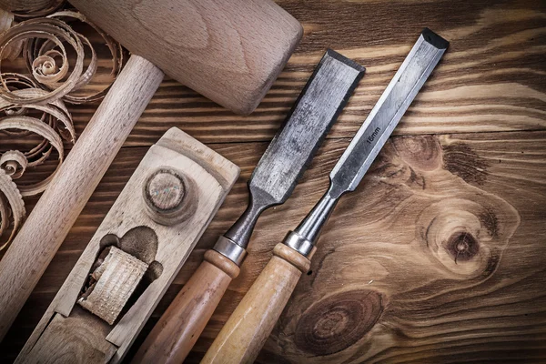 Wooden mallet, shaving plane and chisels