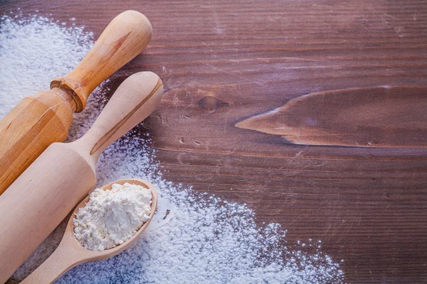 Wooden spoon with white natural flour