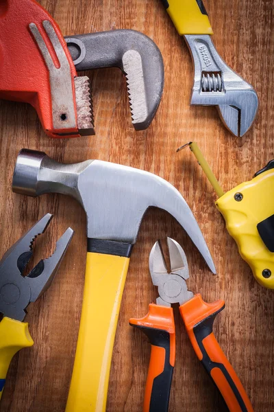 Set of tools on wooden board