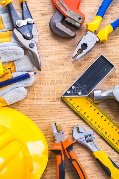 Set of working tools on wooden board