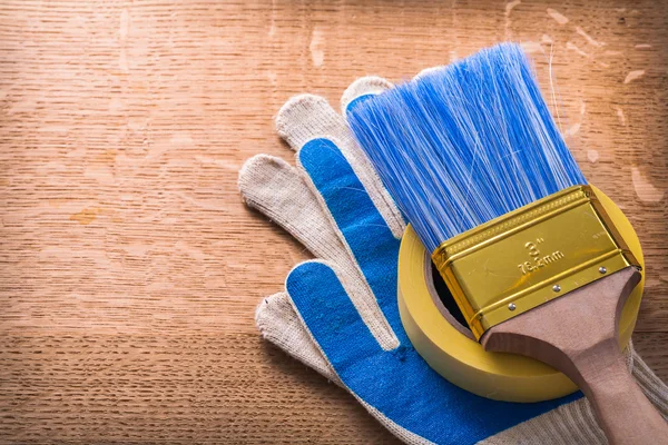Protective gloves paint brush and duct tape