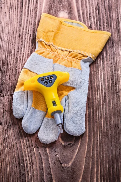 Insulated electric screwdriver and protective glove