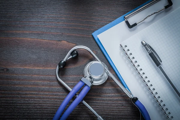 Stethoscope on vintage wooden background