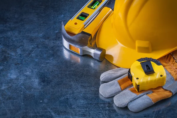 Safety gloves, hard hat and hammer