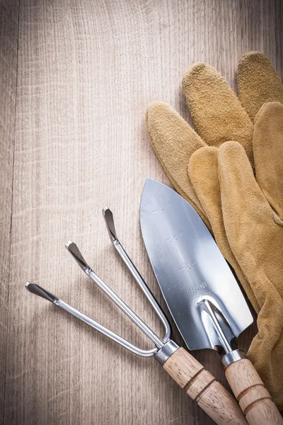 Trowel fork with shovel and safety gloves