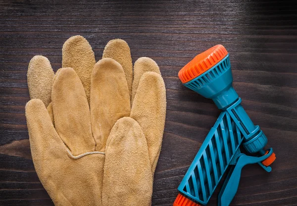 Hose nozzle and leather safety gloves