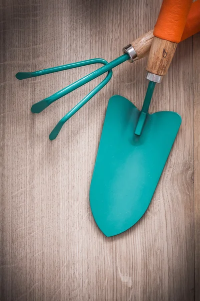 Metal hand spade and gardening rake