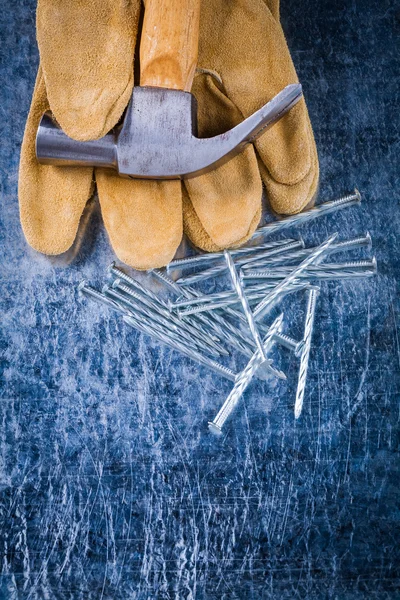 Gloves, nails and claw hammer