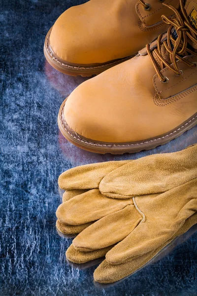 Leather working boots and protective gloves