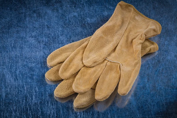 Pair of leather brown protective gloves