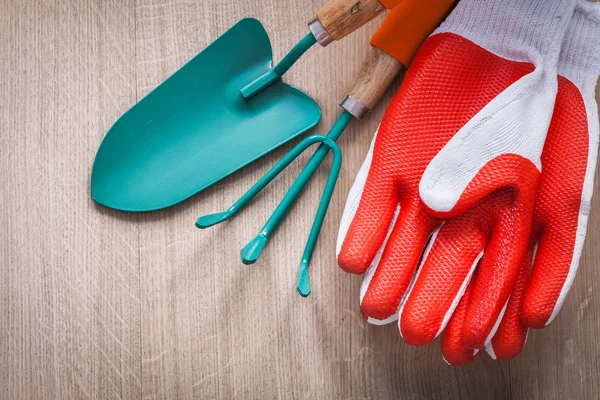 Safety gloves, shovel and gardening rake