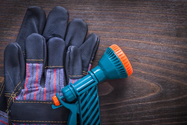 Spray nozzle and rubber safety gloves