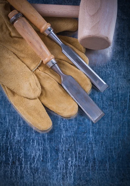 Wooden mallet, chisels and safety gloves