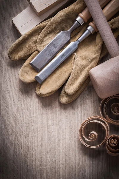 Wooden planks, hammer, working gloves