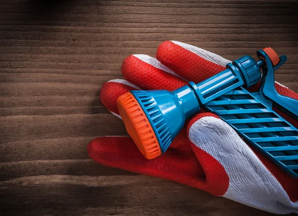 Gardening glove and water spray nozzle