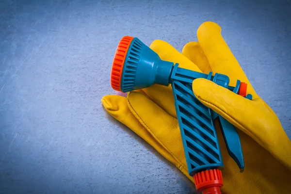 Protective gloves with garden water sprinkler