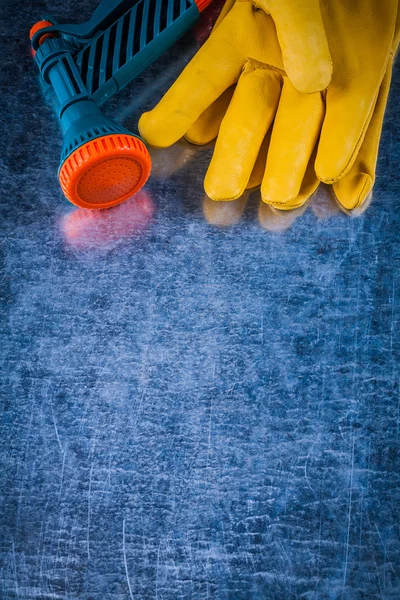 Protective gloves and water sprayer