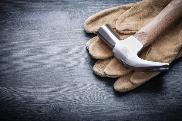 Claw hammer on working gloves