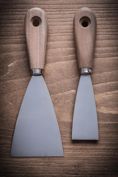 Paint scrapers with wood handles