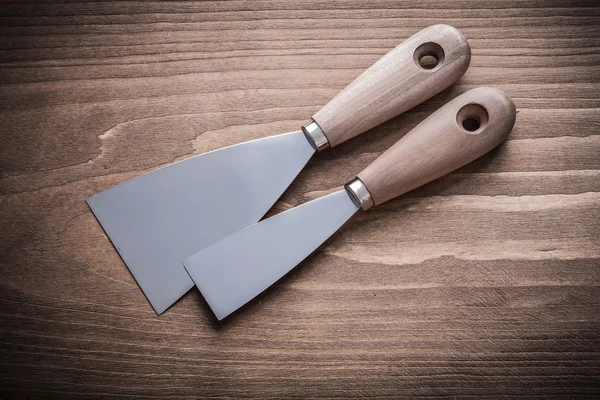 Putty knives with wooden handles