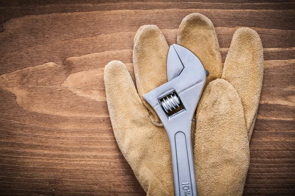 Adjustable spanner and protective glove