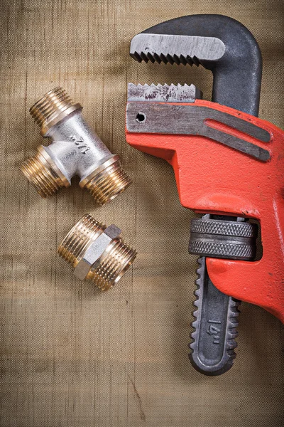 Pipe wrench and plumbing fixtures